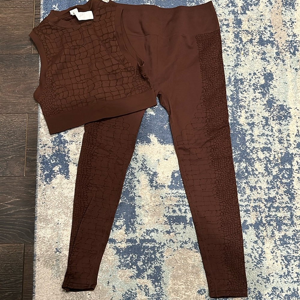 Like new. Fabletics Athletic set. Worn once. Pants XL. Top. L